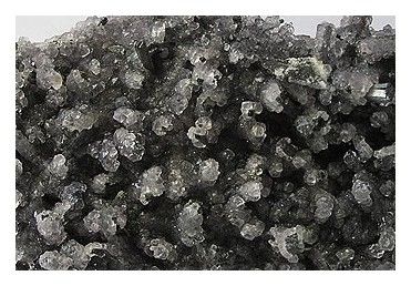 Banpo detail: fluorite contrasting with metallic stibnite.