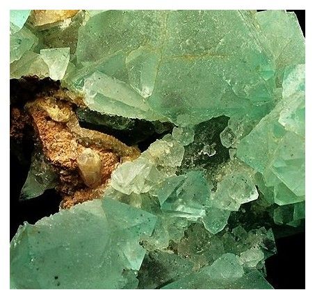 Riemvasmaak detail: bright green fluorite and crystal form.